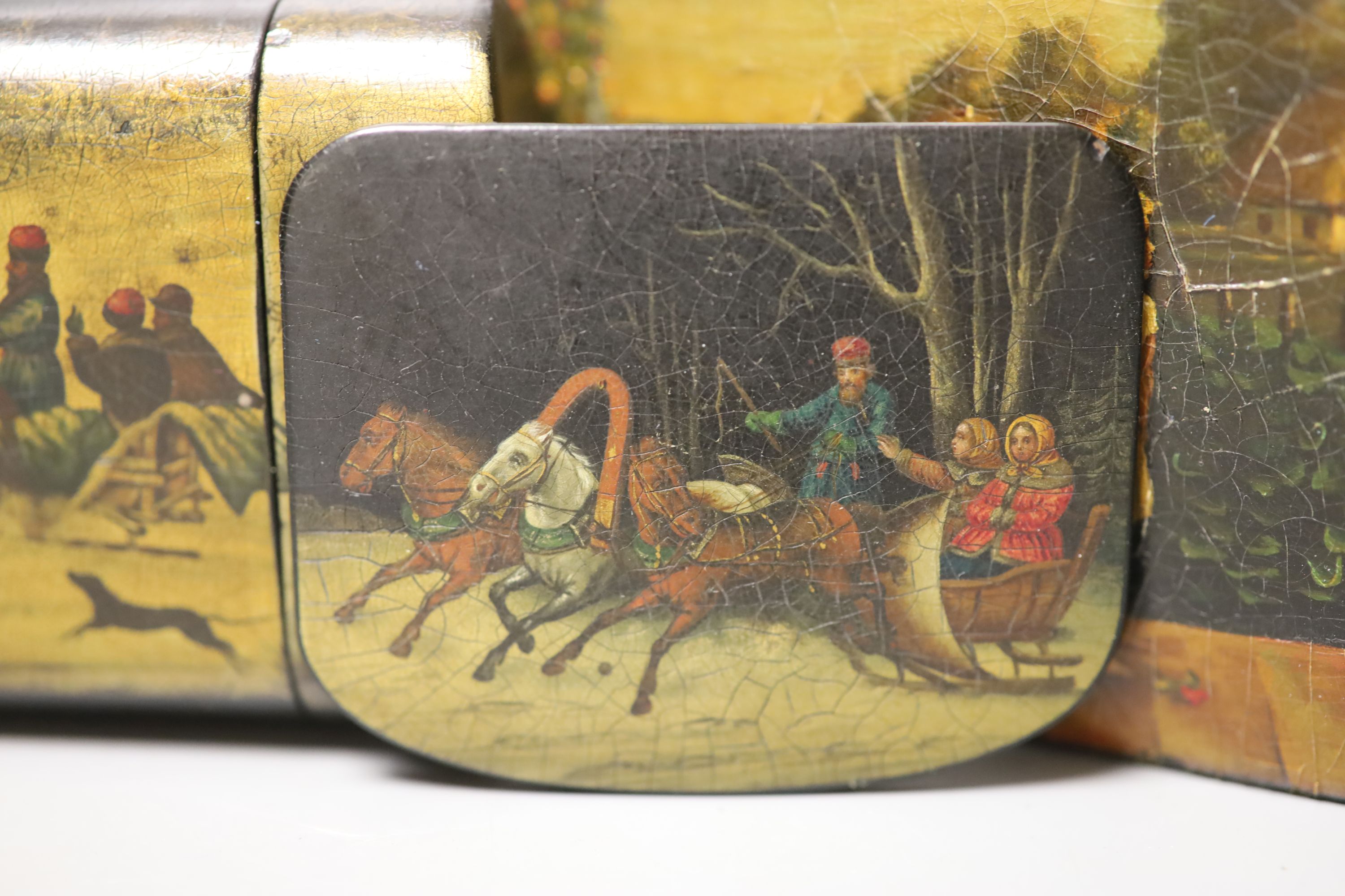 Two Russian papier mache boxes painted with troika and two related items, largest 17 x 5cm